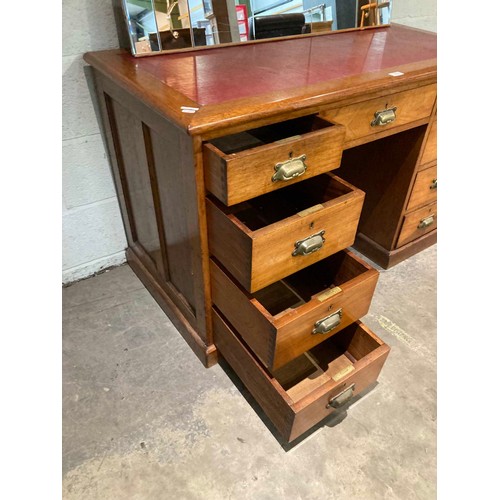 27 - Victorian mahogany pedestal campaign desk with brass handles and red leather inset 77H 122W 60D