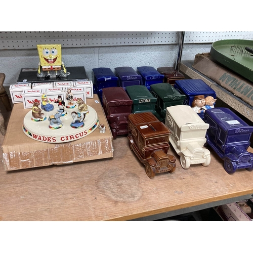 11 ceramic Wade vehicle money boxes incl Tetley Tea, Lyons, Cadbury's etc with a boxed Wade Sponge Bob Square Pants  money box and Wade's Circus with 7 boxed figurines