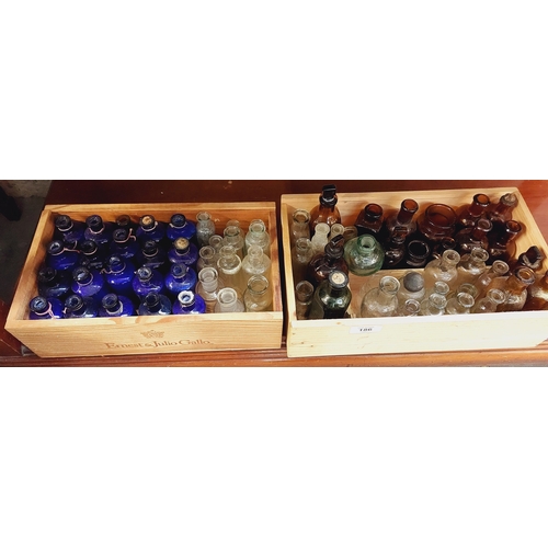 186 - 2 Boxes of Coloured Glass Chemist Bottles