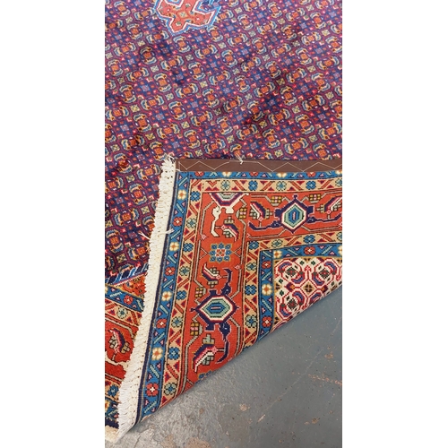 269 - Red & Blue Hand Knotted Iranian Rug - C. 307cm x 204cm