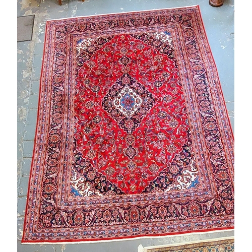 391 - Large Red Hand Knotted Rug - C. 340cm x 240cm