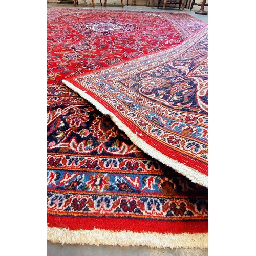 391 - Large Red Hand Knotted Rug - C. 340cm x 240cm