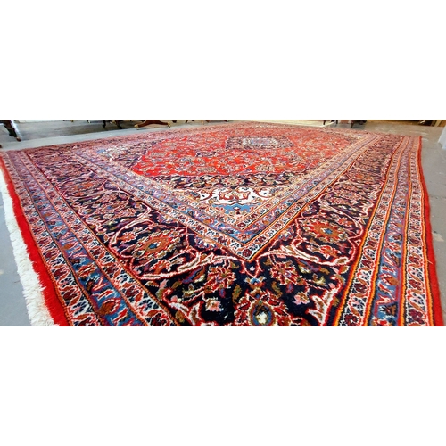 391 - Large Red Hand Knotted Rug - C. 340cm x 240cm