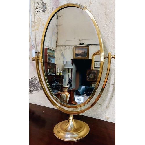 493 - Oval Brass Frame Rotating Vanity Mirror - C. 57cm H