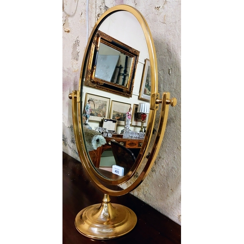 493 - Oval Brass Frame Rotating Vanity Mirror - C. 57cm H