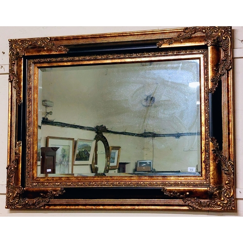 510 - Ornate Gilt and Ebonised Bevelled Overmantle Mirror - C. 124cm x 94cm