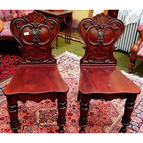 557 - Pair of Mahogany Carved Shield Back Hall Chairs with Painted Lion Crest