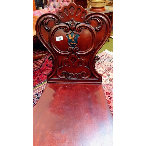 557 - Pair of Mahogany Carved Shield Back Hall Chairs with Painted Lion Crest