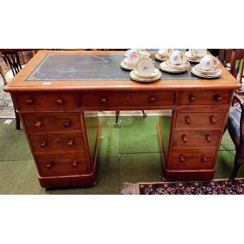 576 - Neat Mahogany Gilt Tooled Leather Top Writing Desk with 9 Drawers sitting on Brass Castors - C. 122c... 