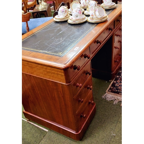 576 - Neat Mahogany Gilt Tooled Leather Top Writing Desk with 9 Drawers sitting on Brass Castors - C. 122c... 