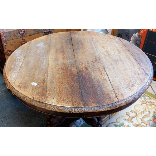 801 - Circular Oak Table on Highly Carved Pod Base - C. 114cm W x 71cm H