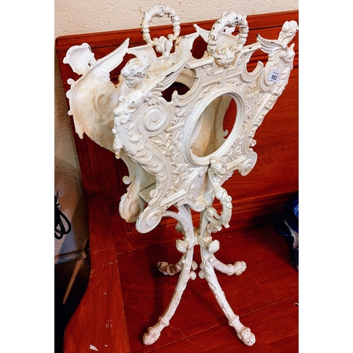 882 - Cream Painted Cast Metal Magazine Holder on Splayed Legs