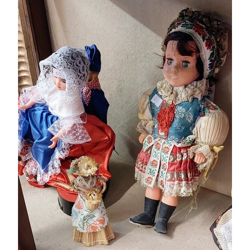 780 - 9 Vintage Costume Dolls