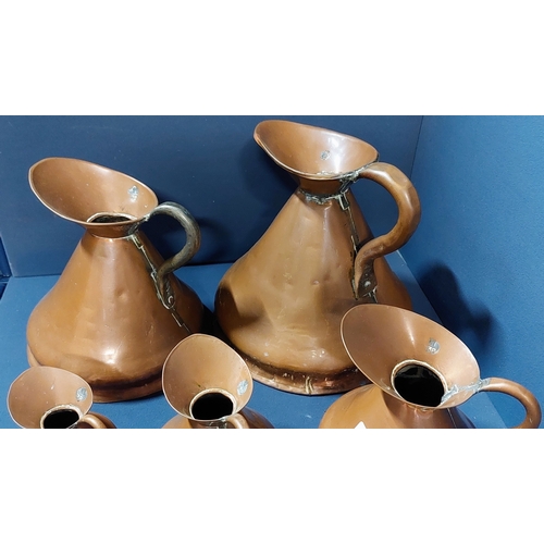 152 - Set of 7 Graduated Copper Jugs