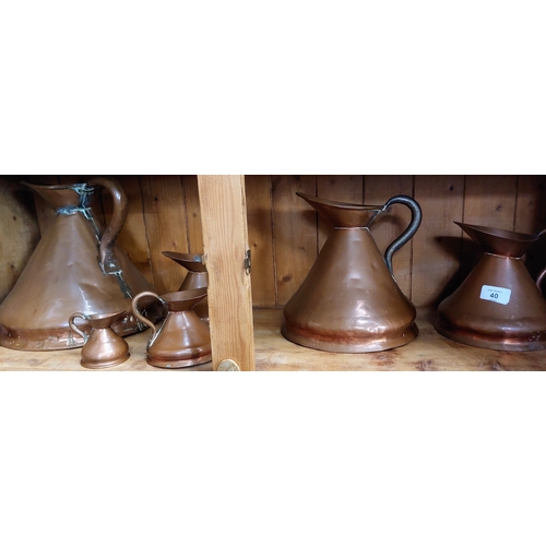 40 - Set of 7 Graduated Copper Jugs