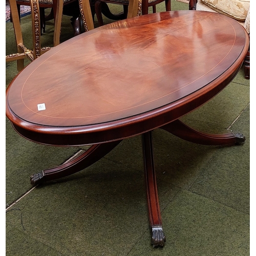 612 - Mahogany Inlaid Oval Coffee Table on a Splayed Leg Base and Brass Paw Castors - C. 122cm W x 70cm D ... 