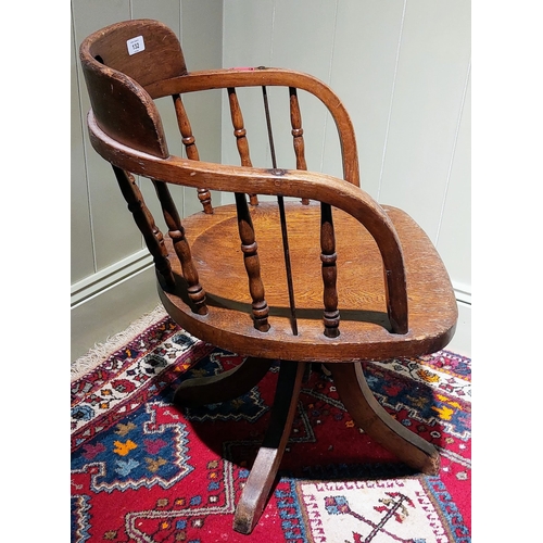 132 - Oak Spindle Back Revolving Clerks Chair