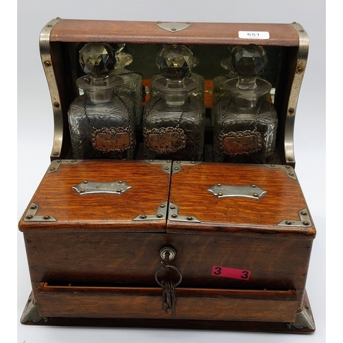 651 - Oak Tantalus with 3 Cut Glass Decanters and Irish Silver Labels; Top Opening Box and Secret Drawer