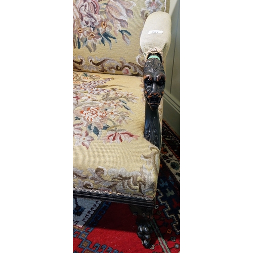 751 - Highly Carved Early 19th Century Mahogany Tapestry Covered Armchair with Lion Head Armrests and Paw ... 