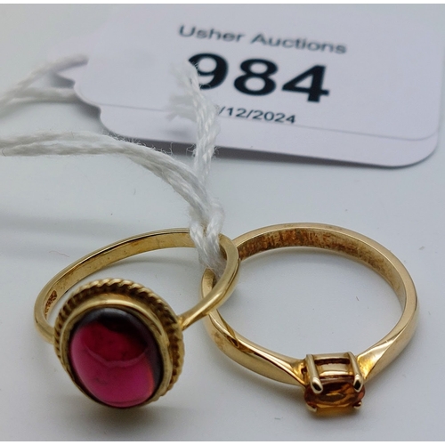 984 - 2 x 9 ct Gold Ladies Dress Rings - Garnet Stone (size N) & Amber Stone (size L)