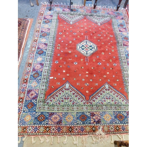 1083 - Hand Knotted Red Wool Rug - C. 244cm x 170cm