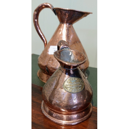 22 - 4 Graduated Copper Jugs and a Copper Fish Pan with Burners and Stand