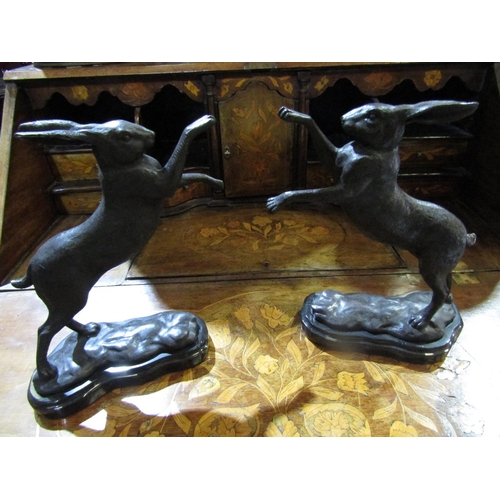 66 - Pair of Bronze Sculptures Boxing Hares on Shaped Form Marble Bases Each Approximately 12 Inches High