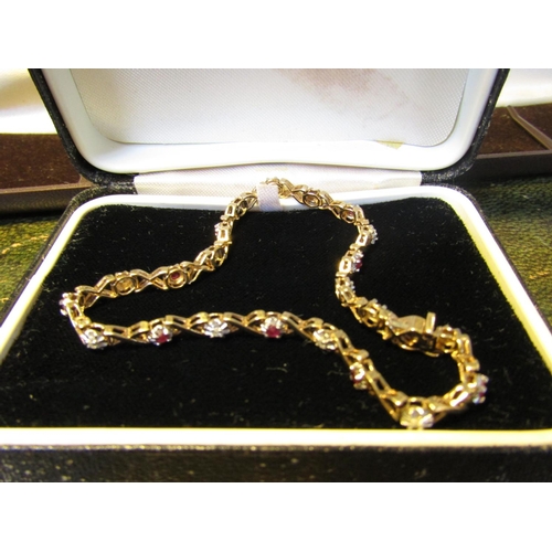 61 - 9 Carat Gold Diamond and Ruby Set Ladies Bracelet of Articulated Form Approximately Bracelet Length ... 