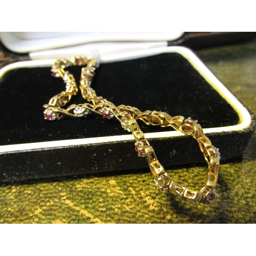 61 - 9 Carat Gold Diamond and Ruby Set Ladies Bracelet of Articulated Form Approximately Bracelet Length ... 