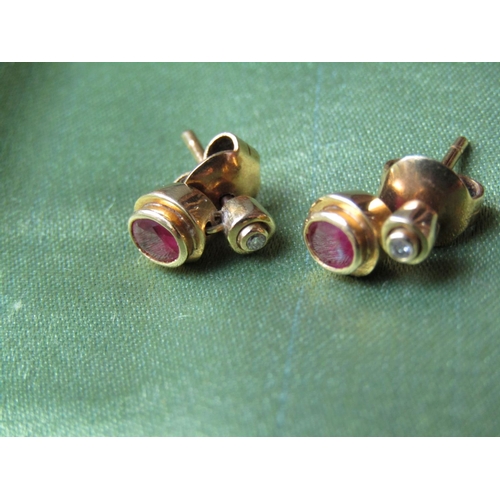 65 - Pair of 18 Carat Gold Ruby and Diamond Earrings