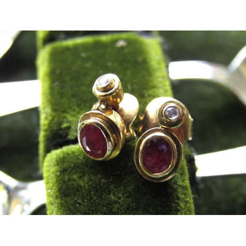 65 - Pair of 18 Carat Gold Ruby and Diamond Earrings