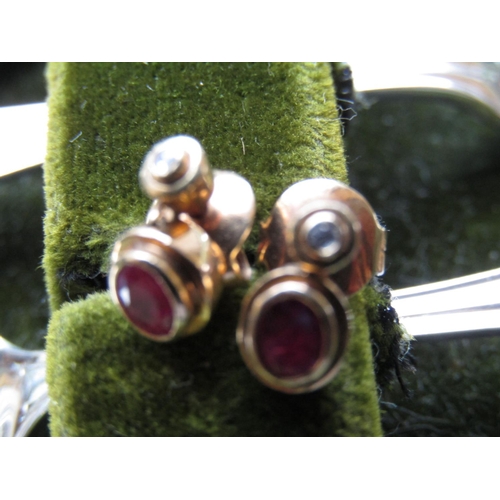 65 - Pair of 18 Carat Gold Ruby and Diamond Earrings