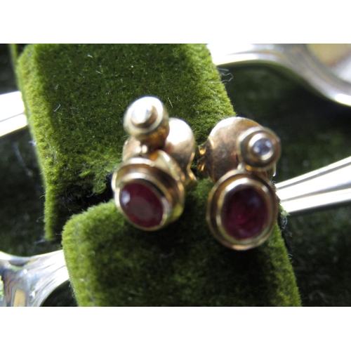 65 - Pair of 18 Carat Gold Ruby and Diamond Earrings