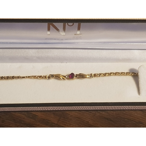 627 - 14 Carat Claddagh Bracelet with Diamond and Ruby One Diamond Missing