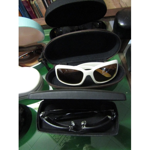 1204 - Four Pairs of Ladies Designer Sunglasses contained within Cases