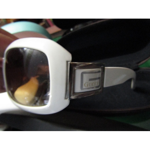 1204 - Four Pairs of Ladies Designer Sunglasses contained within Cases