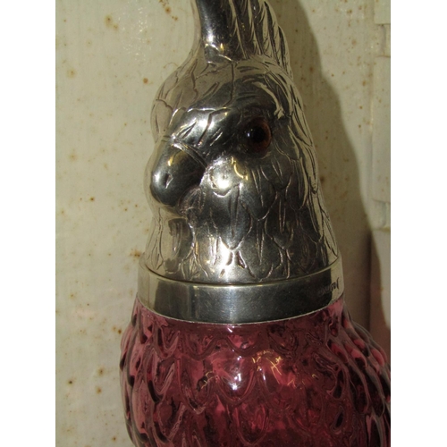 1258 - Solid Silver Mounted Decanter Bottle Parrot Motif with Hinged Cover above Cranberry Glass Body Appro... 