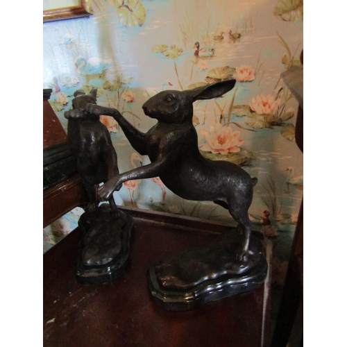 130 - Pair of Sculptures Boxing Hares on Shaped Form Marble Bases Each Approximately 12 Inches High