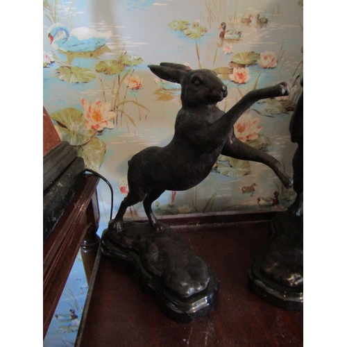 130 - Pair of Sculptures Boxing Hares on Shaped Form Marble Bases Each Approximately 12 Inches High