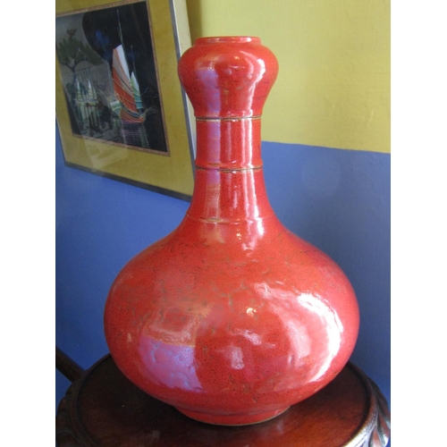 1363 - Red Ground Oriental Onion Form Vase with Slender Neck above Signed Base Approximately 14 Inches High