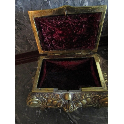 139 - Shaped Form Ormolu Jewellery Box with Hinged Top above Shaped Supports Approximately 8 Inches Wide