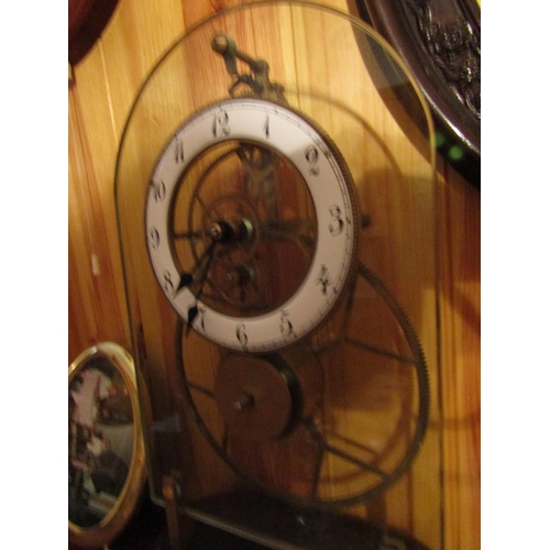 1689 - Dome Crystal Front Plate Decorated Skeletal Form Clock Complete with Pendulum and Key Approximately ... 