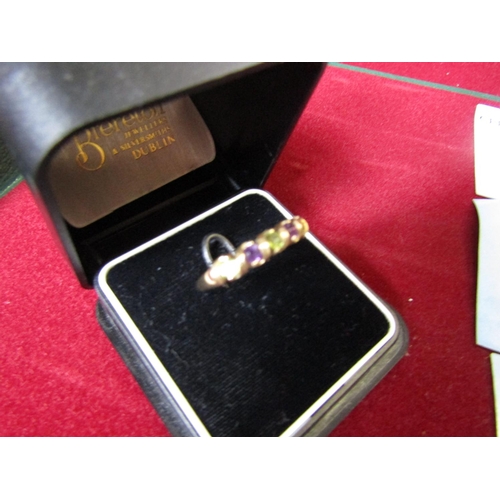 263 - Amethyst and Peridot Ladies Line Ring Mounted on 9 Carat Gold Ring Size N