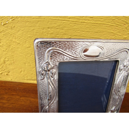 284 - Pair of Solid Silver Embossed Decorated Photograph Frames Approximately 7 Inches High x 5 Inches Wid... 