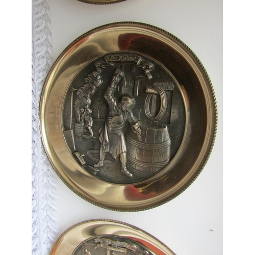 294 - Set of Four Heavy Brass Wall Chargers Depicting Trades People Each Approximately 13 Inches Diameter