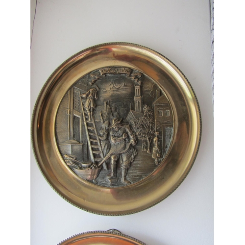 295 - Set of Four Heavy Brass Wall Chargers Depicting Trades People Each Approximately 13 Inches Diameter