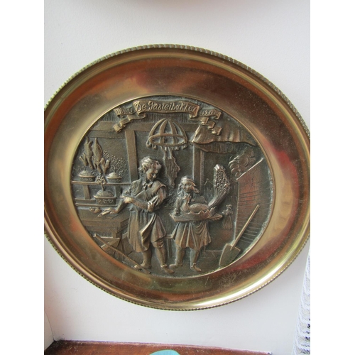 295 - Set of Four Heavy Brass Wall Chargers Depicting Trades People Each Approximately 13 Inches Diameter