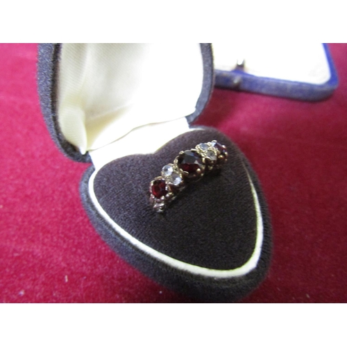 405 - 9 Carat Gold Ladies Ring Mounted with Three Red Garnets and Diamonds