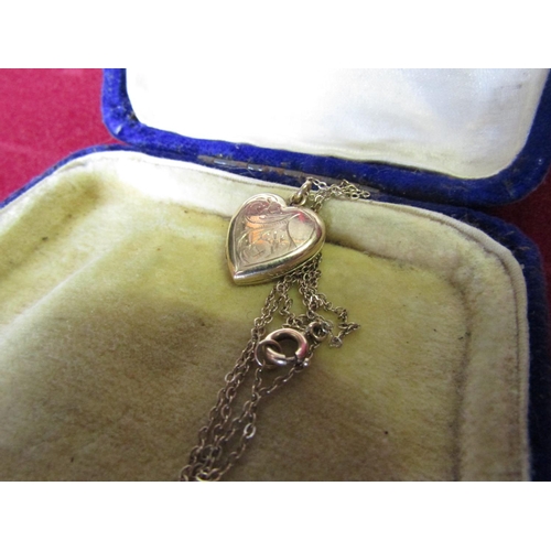 410 - Heart Form Locket with Hinged Cover on 9 Carat Gold Chain