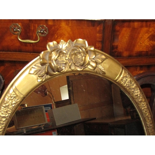 491 - Two Antique Oval Form Gilt Framed Wall Mirrors with Upper Floral Motif Decoration Approximately 26 I... 